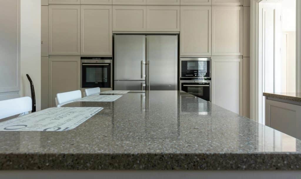 Modern granite kitchen countertop with neutral colors and sleek finish