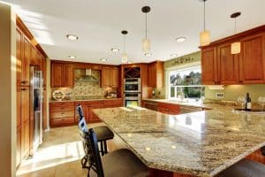 Big Residential Kitchen with Granite Counter tops and Wood Cabinets.