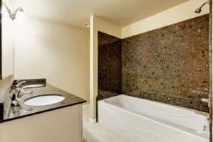 A Bath/Shower Combo with Granite Tile Trim